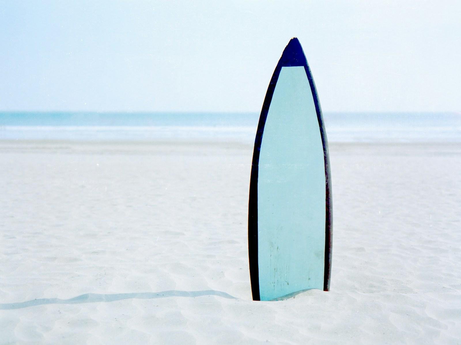 surfboard on seashore